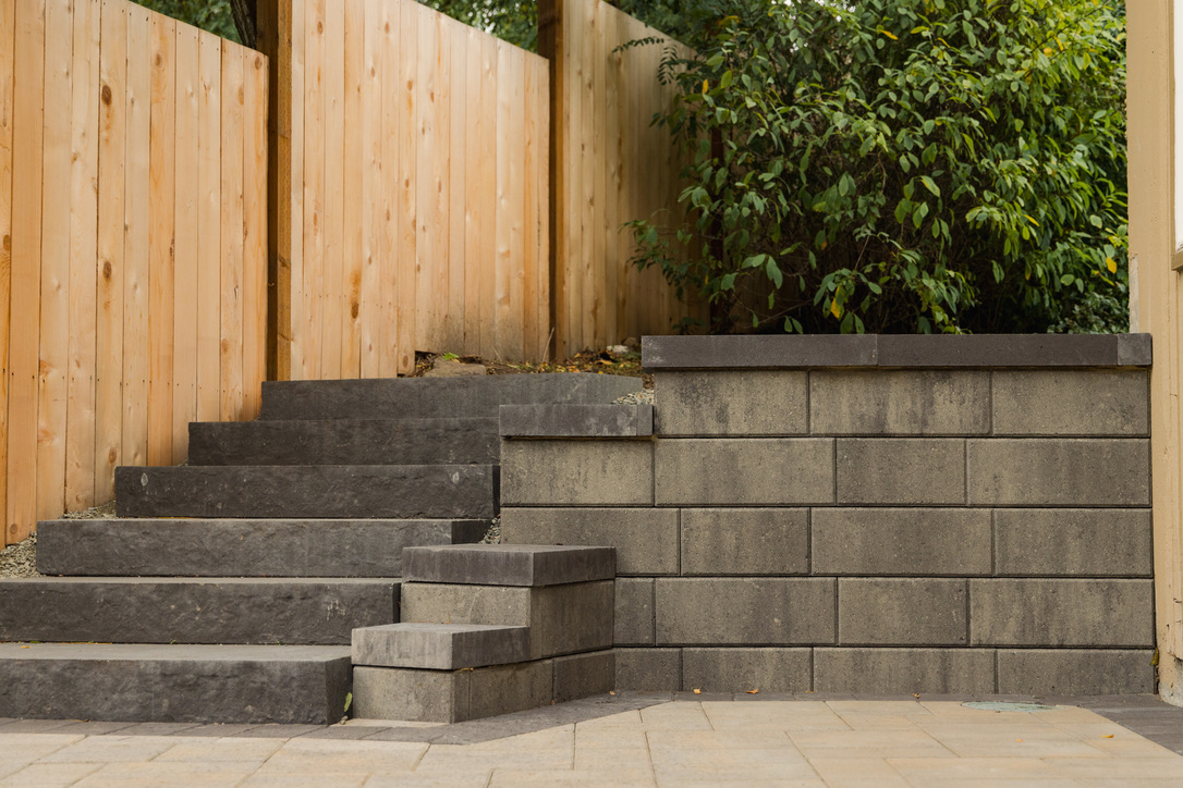 stone steps and retaining wall in backyard